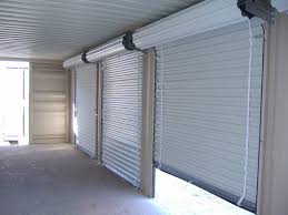 Automatic Rolling Shutters considered as the most efficient industrial rolling shutter supplier in Dubai, Sharjah, Ajman, Umm Al Quwain, Ras Al Khaimah, Fujairah, Abu Dhabi, Al Ain, and UAE. It represents the rolling shutters of the top manufacturing brands like Wayne Dalton, Steel-Line, Dexion, Accessa, Bolton Gate and many others. The rolling shutters are basically sectional overhead doors with a number of horizontal slats hinged together.

Doors are maintained with great care in the industrial sectors in order to ensure proper safety of valuable equipment from different burglary and Vandalism attempts. In order to avoid such cases, rolling shutters are highly used in the industries. There is a great demand for these rolling shutters in the Middle East countries.

These doors are designed with a vertical sliding mechanism and are mainly used at the entrance or exit of a chamber or building. These are also termed as coiling metal door barriers as they act as an efficient barrier between the interior and the exterior conditions of a chamber. In order to open the door, these shutters are raised upwards while to close these doors, the shutter is lowered downwards.

As these doors are single skin and insulated, a good insulation is maintained within the chamber. The insulated panel absorbs the required heat within the panel, and supplies warm air at the time of requirement. Thus, a lot of energy is being saved as no electrical consumption is maintained within the chamber.

The basic design of these rolling shutters include Bottom bar, Hood cover, Barrel assembly, Side guides, horizontal salts, shutter spring, shutter box, and lock. All these components together facilitate the overall functioning of the rolling shutters. These shutters are mainly used in the factories and warehouses as a proper security is highly demanded for those places.

These shutters are made up of different metals like aluminum, regular steel or stainless steel.  Doors also provides fire rated and non fire-rated rolling shutters as per the requirement of the clients. The small rolling shutters are easily managed with the help of manual strength, but in order to lift large rolling shutters, a great amount of strength is required. So, in the large rolling shutter, a small electrical tubular motor is attached to the roller, in order to operate the shutter automatically.