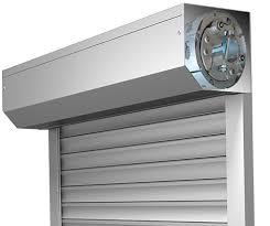 Automatic Rolling Shutters considered as the most efficient industrial rolling shutter supplier in Dubai, Sharjah, Ajman, Umm Al Quwain, Ras Al Khaimah, Fujairah, Abu Dhabi, Al Ain, and UAE. It represents the rolling shutters of the top manufacturing brands like Wayne Dalton, Steel-Line, Dexion, Accessa, Bolton Gate and many others. The rolling shutters are basically sectional overhead doors with a number of horizontal slats hinged together.

Doors are maintained with great care in the industrial sectors in order to ensure proper safety of valuable equipment from different burglary and Vandalism attempts. In order to avoid such cases, rolling shutters are highly used in the industries. There is a great demand for these rolling shutters in the Middle East countries.

These doors are designed with a vertical sliding mechanism and are mainly used at the entrance or exit of a chamber or building. These are also termed as coiling metal door barriers as they act as an efficient barrier between the interior and the exterior conditions of a chamber. In order to open the door, these shutters are raised upwards while to close these doors, the shutter is lowered downwards.

As these doors are single skin and insulated, a good insulation is maintained within the chamber. The insulated panel absorbs the required heat within the panel, and supplies warm air at the time of requirement. Thus, a lot of energy is being saved as no electrical consumption is maintained within the chamber.

The basic design of these rolling shutters include Bottom bar, Hood cover, Barrel assembly, Side guides, horizontal salts, shutter spring, shutter box, and lock. All these components together facilitate the overall functioning of the rolling shutters. These shutters are mainly used in the factories and warehouses as a proper security is highly demanded for those places.

These shutters are made up of different metals like aluminum, regular steel or stainless steel.  Doors also provides fire rated and non fire-rated rolling shutters as per the requirement of the clients. The small rolling shutters are easily managed with the help of manual strength, but in order to lift large rolling shutters, a great amount of strength is required. So, in the large rolling shutter, a small electrical tubular motor is attached to the roller, in order to operate the shutter automatically.