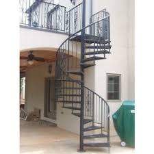 SPIRAL STAIR CASE MANUFACTURERS IN DUBAI, SHARJAH, AJMAN, UMM AL QUWAIN, RAS AL KHAIMAH, FUJAIRAH, ABU DHABI, AL ALIN AND UAE
Steel Fabrication Engineering has been making specially designed steel gates, spiral cases and hand rails for many years. One of the challenging among them is the spiral staircase due to it's complexity and the amount of work involved with the stair cases.

There are many challenges in making custom stairs as certain measurements have to be made or kept in mind before creating spiral around steel tank.  One of the challenges is measuring the curvature of the stair stingers which is two part steel structure that holds the stair threads together. The stingers must be put together carefully in exact matching curvature perpendicular to the first curve in the arc that is located at precise height at the right exact position in the tank.

Steel Spiral Staircase
Spiral Staircase
What makes it challenging is aligning the outer and inner parts together. The outside stinger must be parallel to inner which must be carefully planned.  The reason is there is some distance out away from the wall of the tank as it requires different curve computation and it has same relation to other stringer in the spiral.

Below is the diagram of spiral steel rail which was built by us and custom measurements were carefully taken. There are different standards for making spiral rails and if rest platforms which are intermediate levels are present then computations start again from the platform level which goes on to the next level. Meticulous care must be taken to check and see if all the substructures must fit in together and maintains the aesthetic sense and beauty. Since we have more than 10 years’ experience making these custom rails, we at AL MUZALAAT BUILDING MAINTENANCE LLC. Engineering are frequently called on to check and correct the installations of handrails, ladders and platforms and we usually advice clients to do their due diligence on the steel fabricator before handing out the contract.

We then use top state of art engineering software to check if all calculations and assumptions made in fabrications are right and ensure every component fits the specifications and fits together as it is supposed to. We have different designs and specifications of the staircases the clients can check before ordering.  We have made many spiral staircases for government buildings, villas and many commercial buildings in the region.